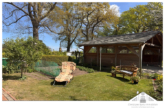 Garten hinten - Mit Blick auf den Schweriner See – Eigenheim mit kleiner Ferienwohnung zu verkaufen